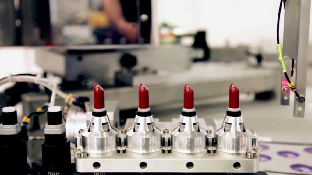 cosmetic factory making tubes of lipstick